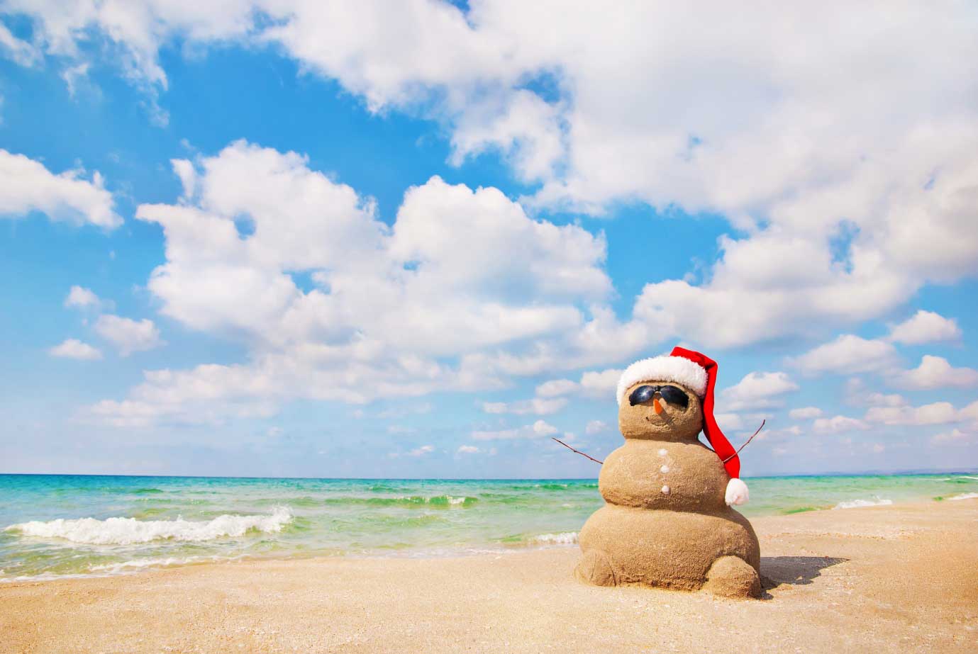 snowman sandcastle on the beach